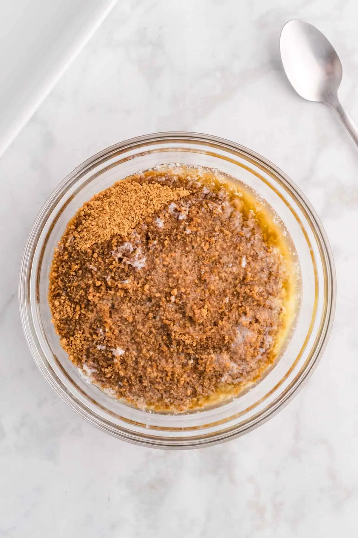 melted butter and gingersnap crumbs in a bowl