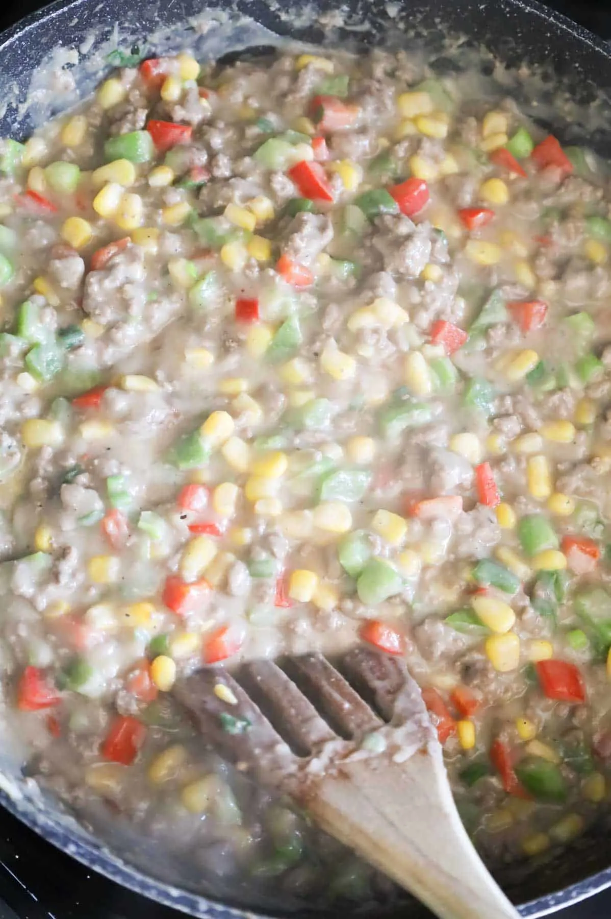 instant mashed potato, ground beef and veggie mixture in a skillet