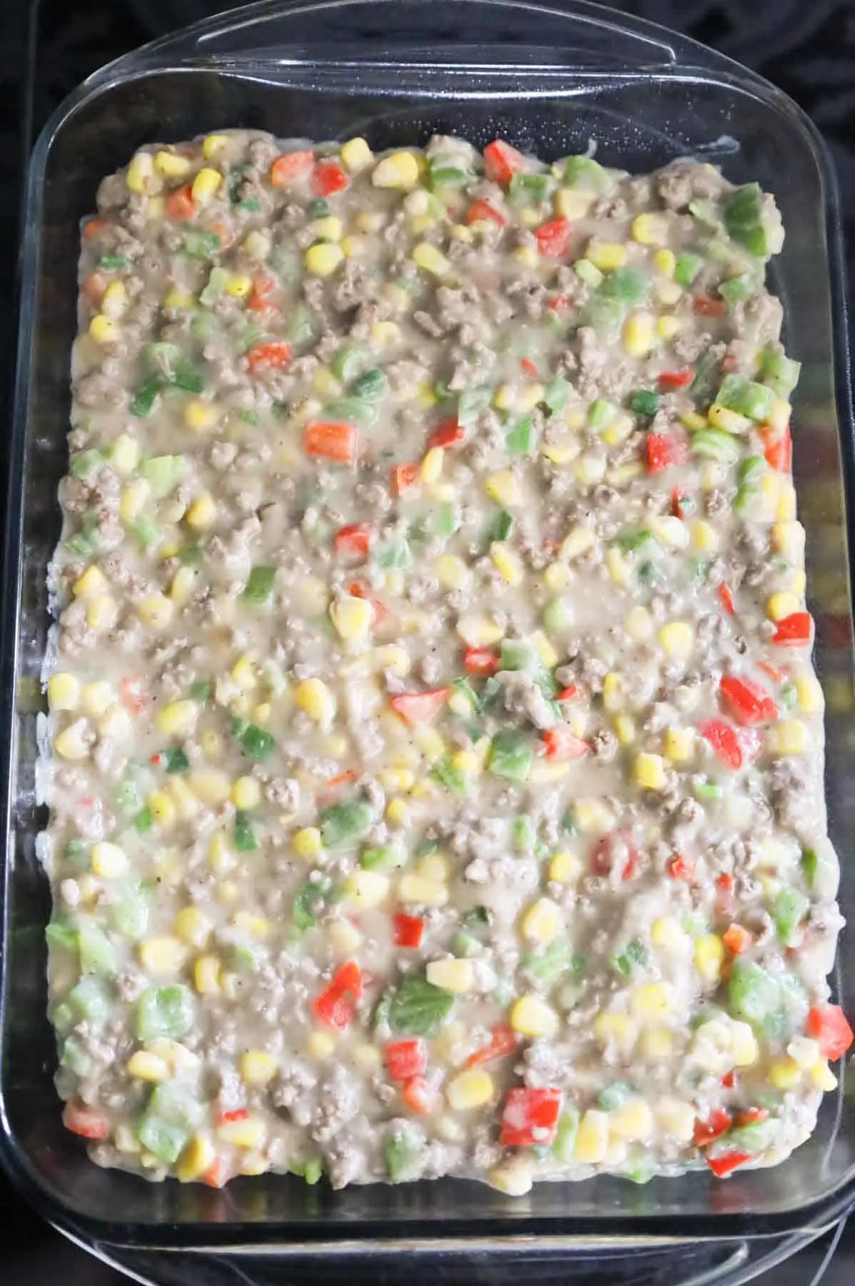 ground beef, instant mashed potato, corn and bell pepper mixture in a baking dish