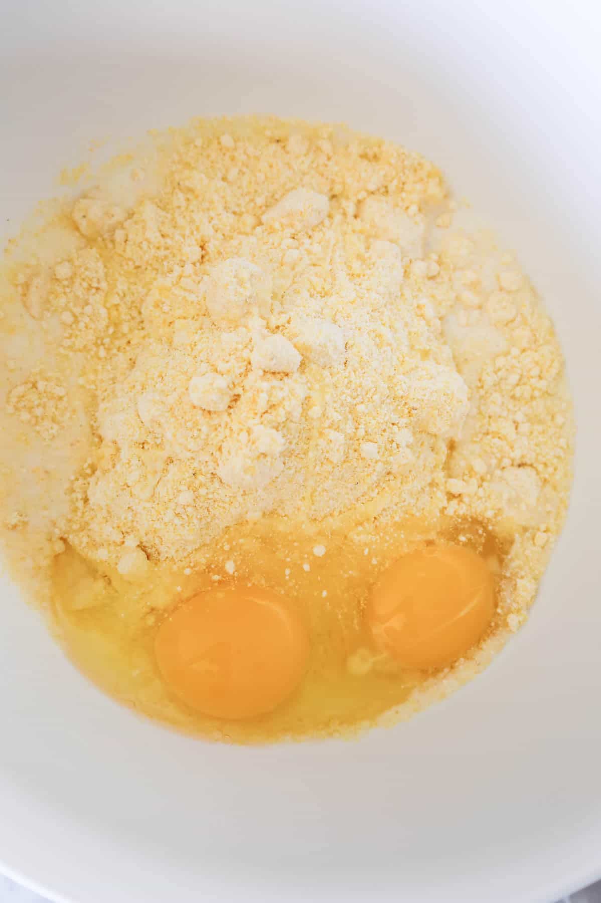 Jiffy corn mix, eggs and milk in a bowl