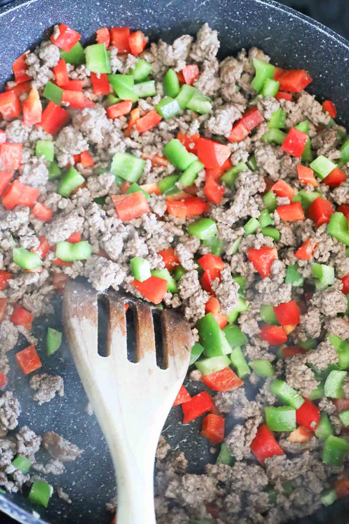 ground beef and diced bell pepper mixture in a skillet