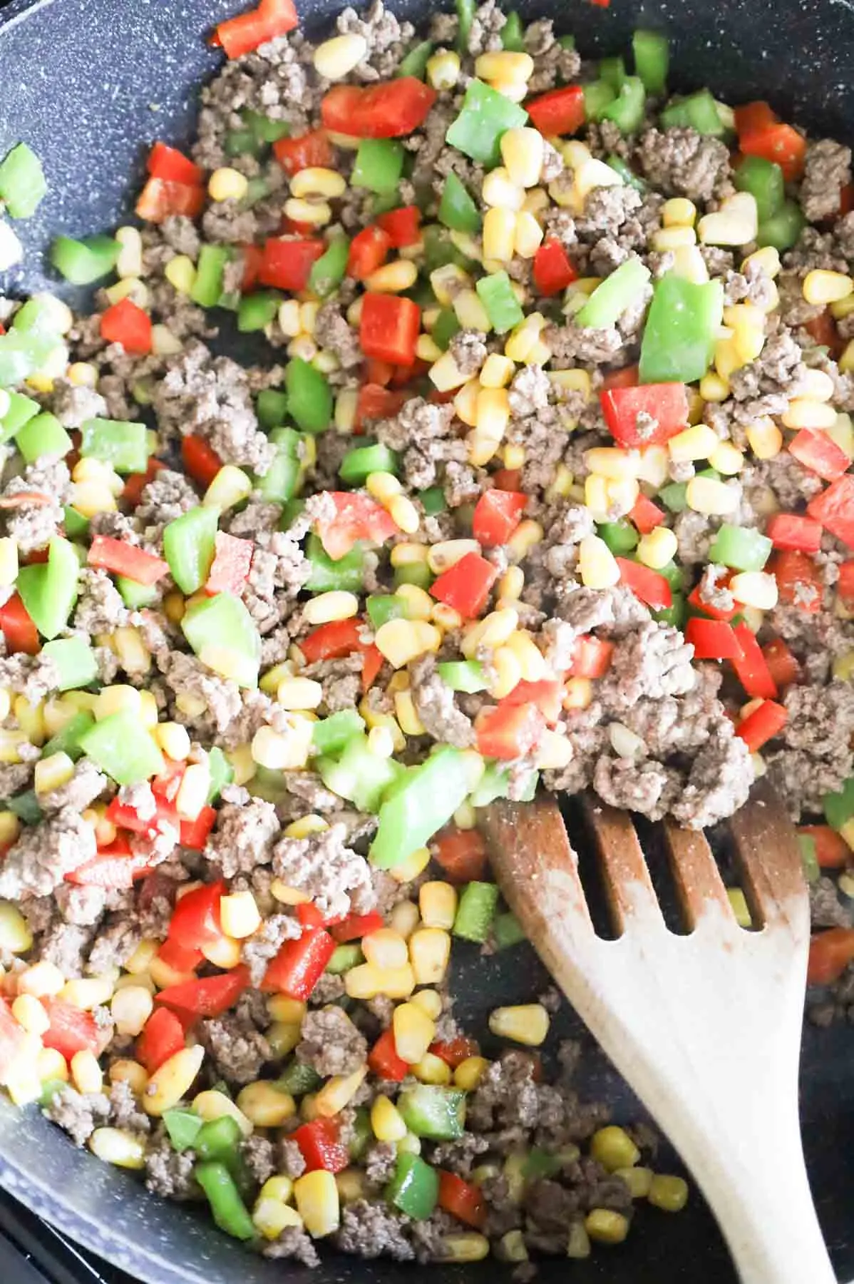 ground beef, corn and bell pepper mixture in a skillet