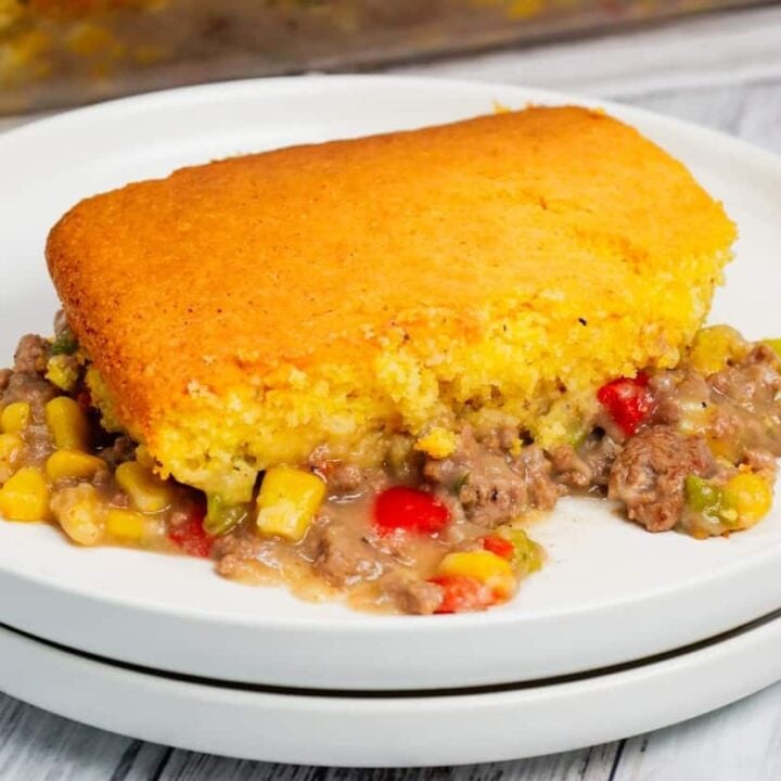 Shepherd's Pie with Cornbread is a Tex-Mex twist on a classic dish using Jiffy corn muffin mix, diced red and green peppers, corn, ground beef, instant mashed potatoes and chopped green onions.