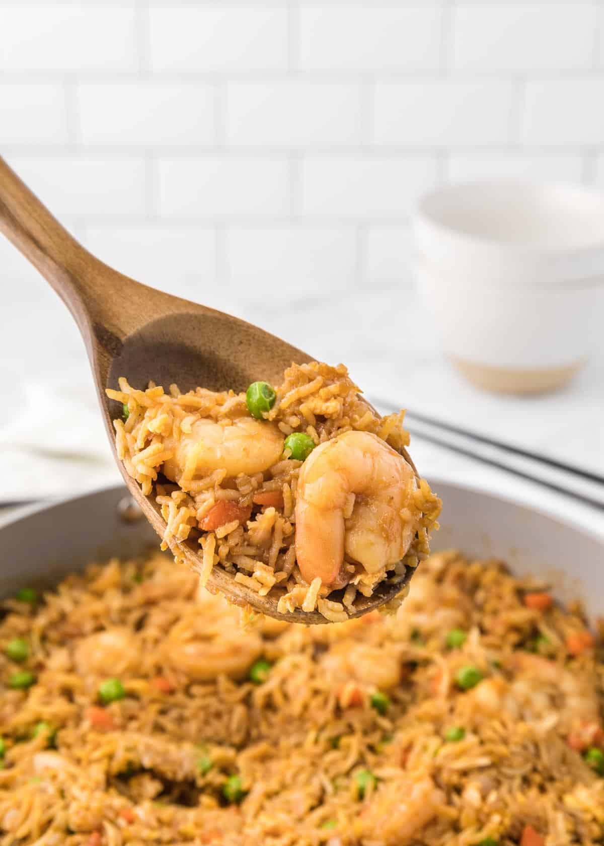 Easy Shrimp Fried Rice is a delicious dinner recipe loaded with shrimp, peas, carrots, onions, eggs, rice and soy sauce.