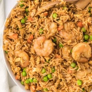 Easy Shrimp Fried Rice is a delicious dinner recipe loaded with shrimp, peas, carrots, onions, eggs, rice and soy sauce.