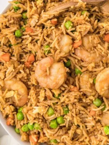 Easy Shrimp Fried Rice is a delicious dinner recipe loaded with shrimp, peas, carrots, onions, eggs, rice and soy sauce.