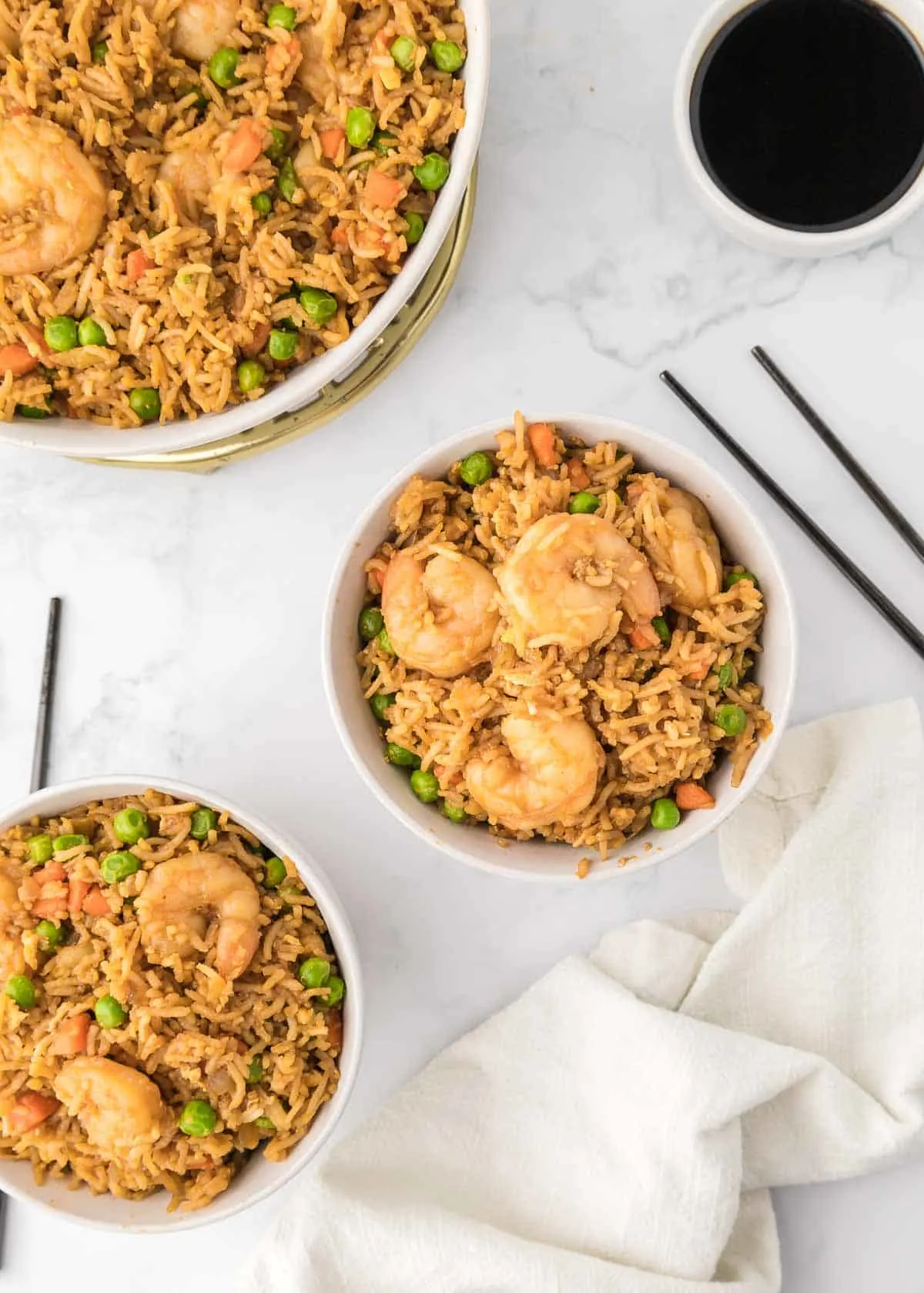 Easy Shrimp Fried Rice is a delicious dinner recipe loaded with shrimp, peas, carrots, onions, eggs, rice and soy sauce.