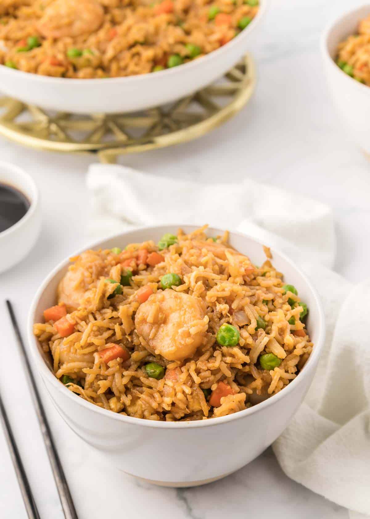 Easy Shrimp Fried Rice is a delicious dinner recipe loaded with shrimp, peas, carrots, onions, eggs, rice and soy sauce.