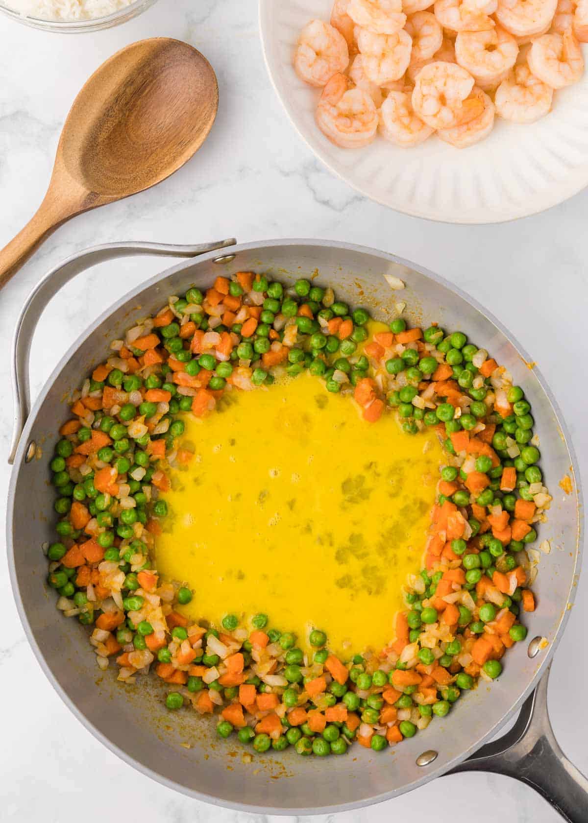 beaten egg added to skillet with veggie mixture