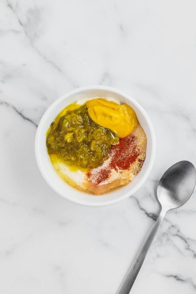 mayo, mustard, relish and spices in a small bowl