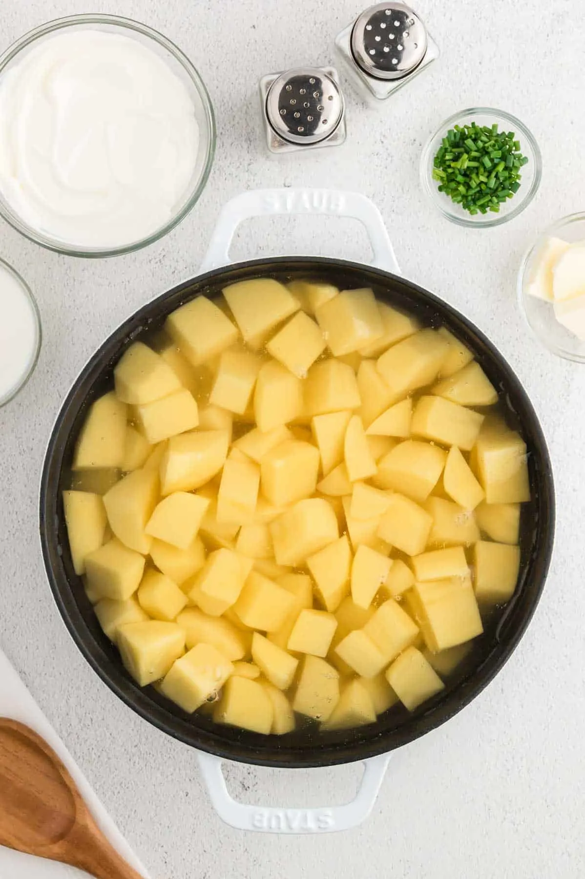 raw potato cubes in a pot filled with cold water