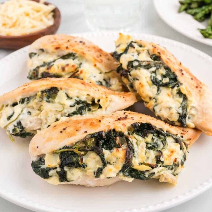 Spinach Artichoke Stuffed Chicken Breasts are a delicious boneless, skinless chicken breast recipe loaded with cream cheese, mozzarella, spinach and chopped artichoke hearts.