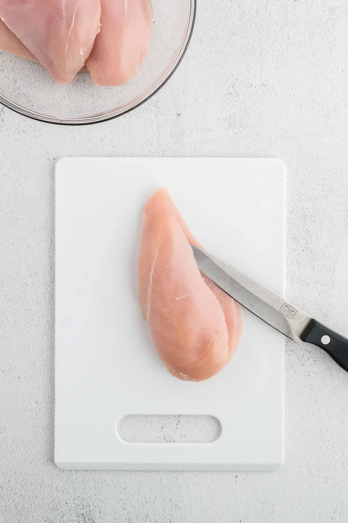 slicing a pocket in a chicken breast