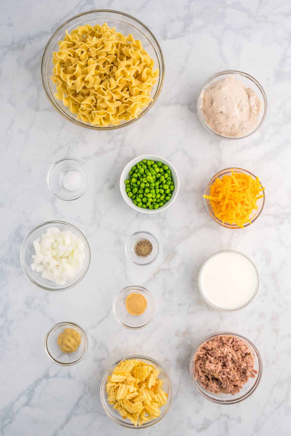 tuna noodle casserole ingredients in prep bowls