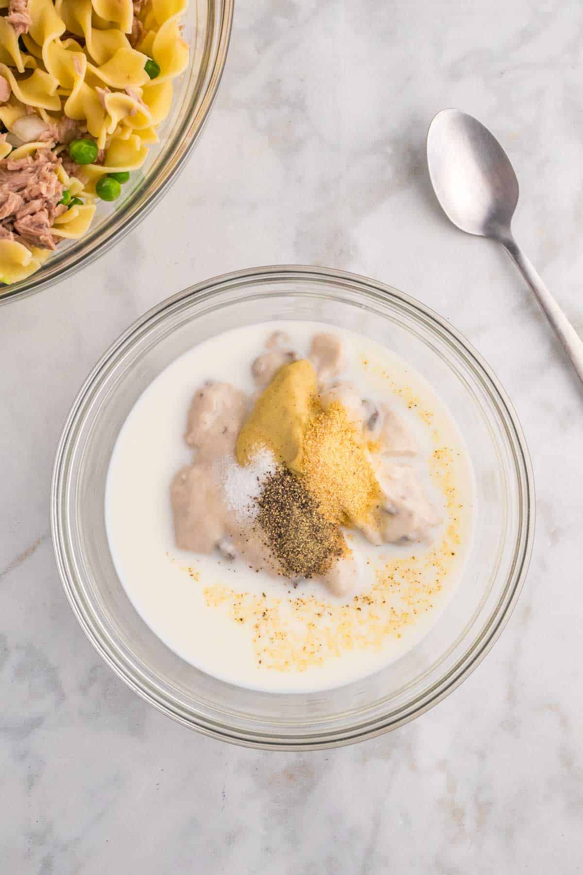 milk, cream of mushroom soup, Dijon mustard and spices in a bowl