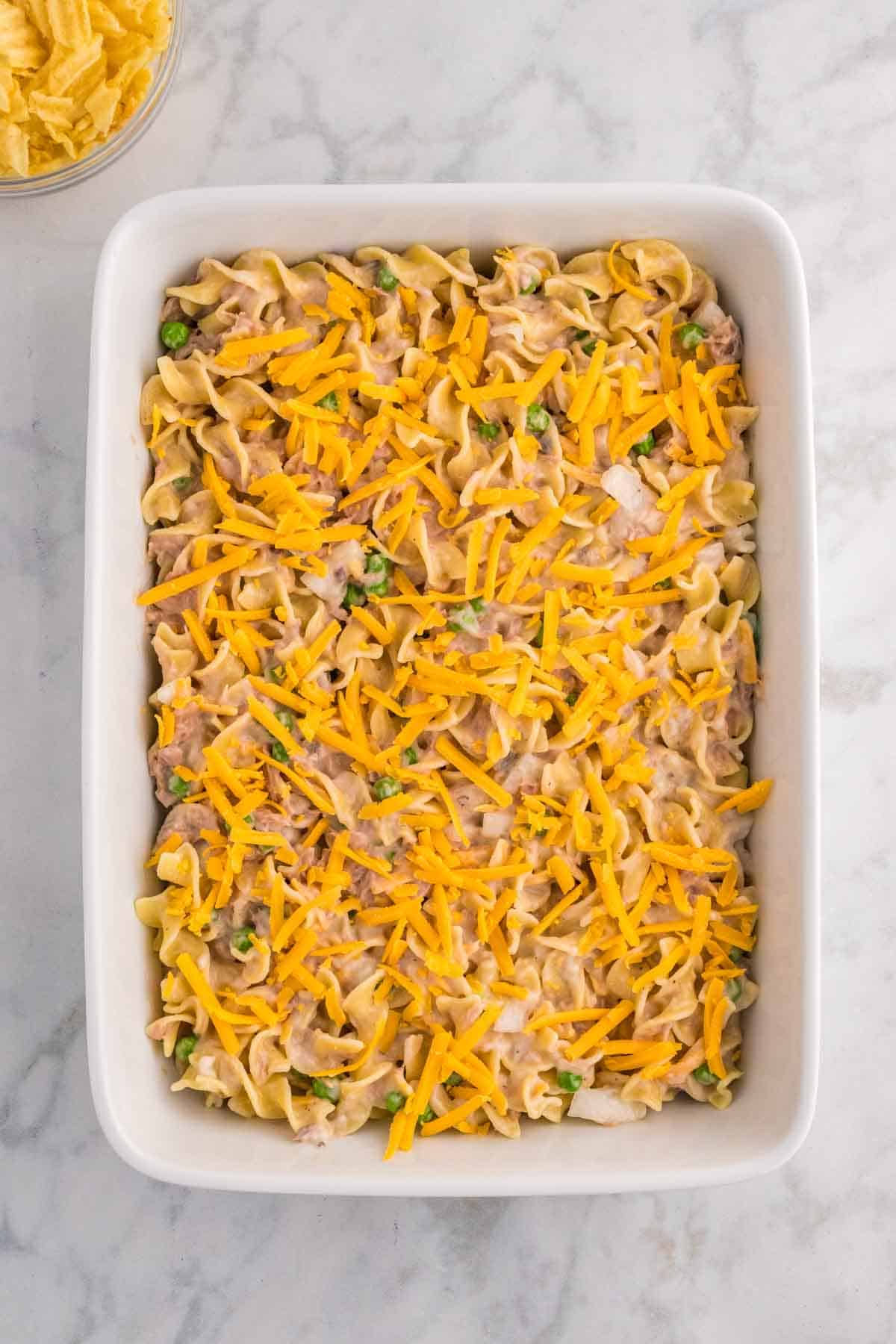 shredded cheese on top of tuna noodle casserole