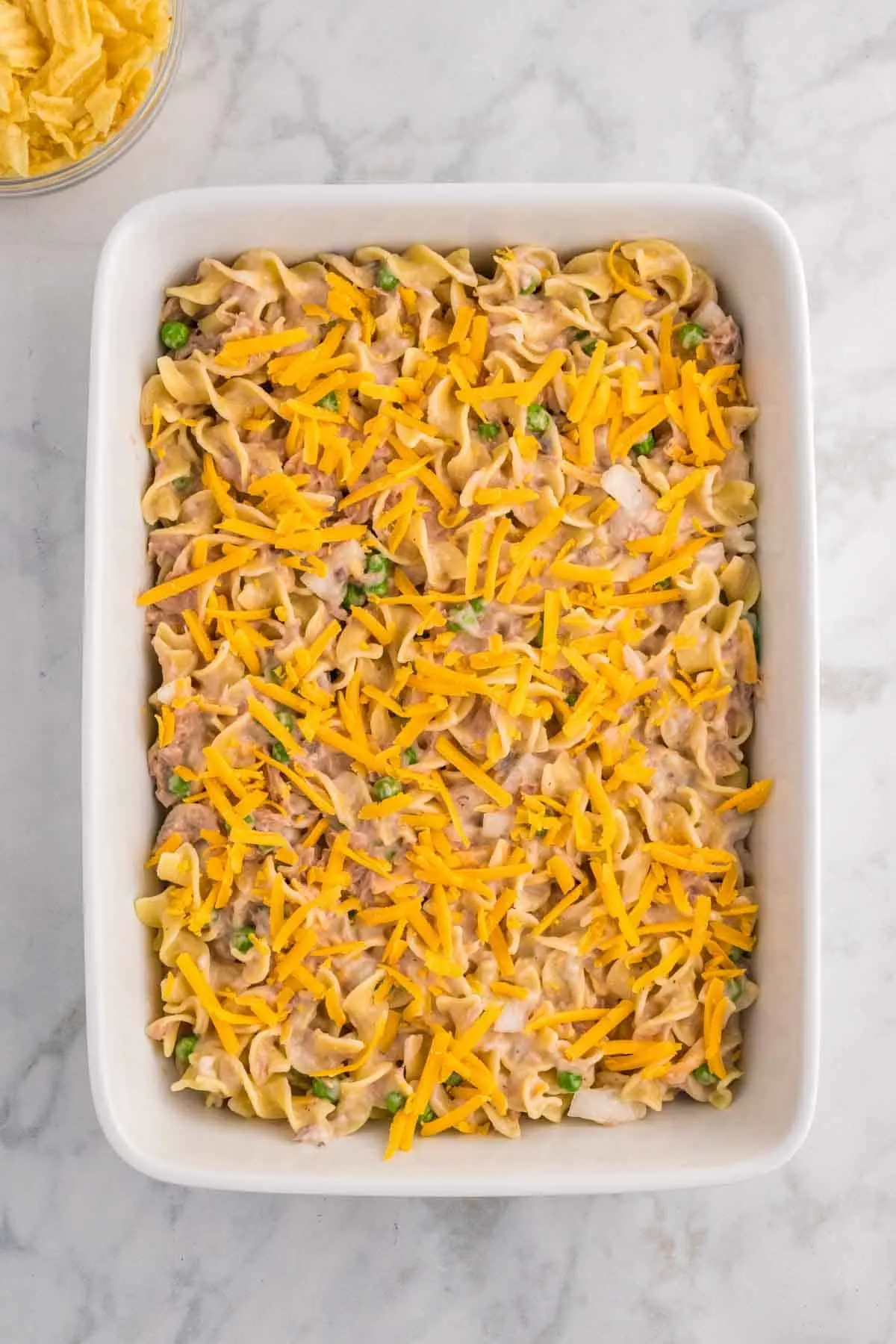 shredded cheese on top of tuna noodle casserole
