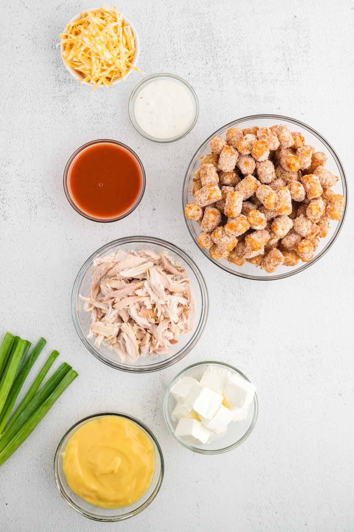 Buffalo chicken tater tot casserole ingredients in prep bowl