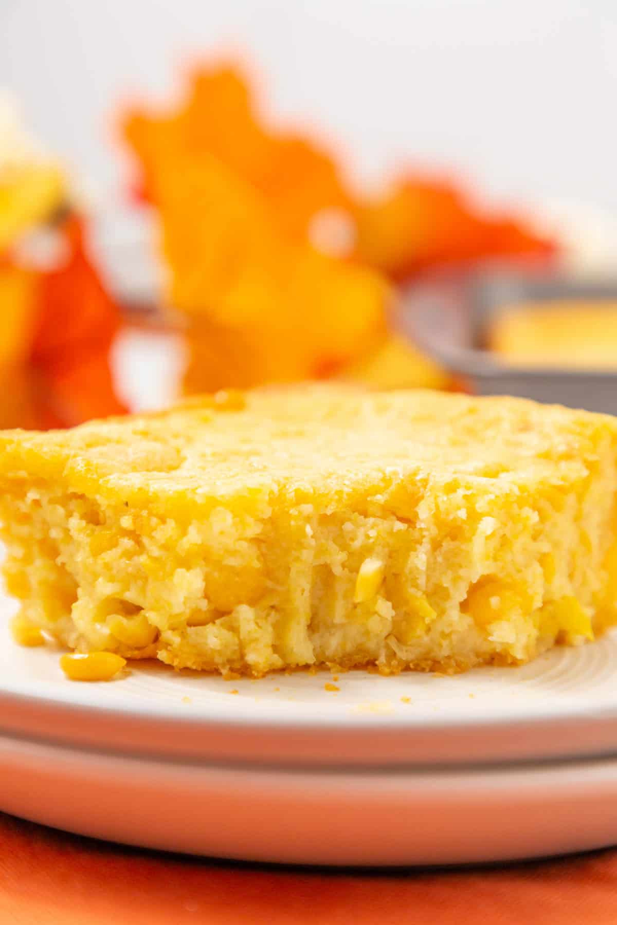 Corn Soufflé is a moist and delicious corn casserole recipe made with canned whole kernel corn, cream corn, sour cream, egg, Jiffy corn muffin mix and melted butter.