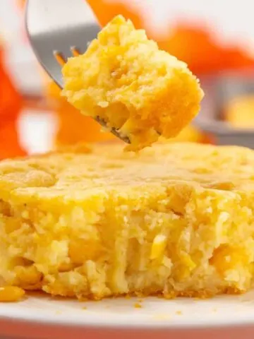 Corn Soufflé is a moist and delicious corn casserole recipe made with canned whole kernel corn, cream corn, sour cream, egg, Jiffy corn muffin mix and melted butter.