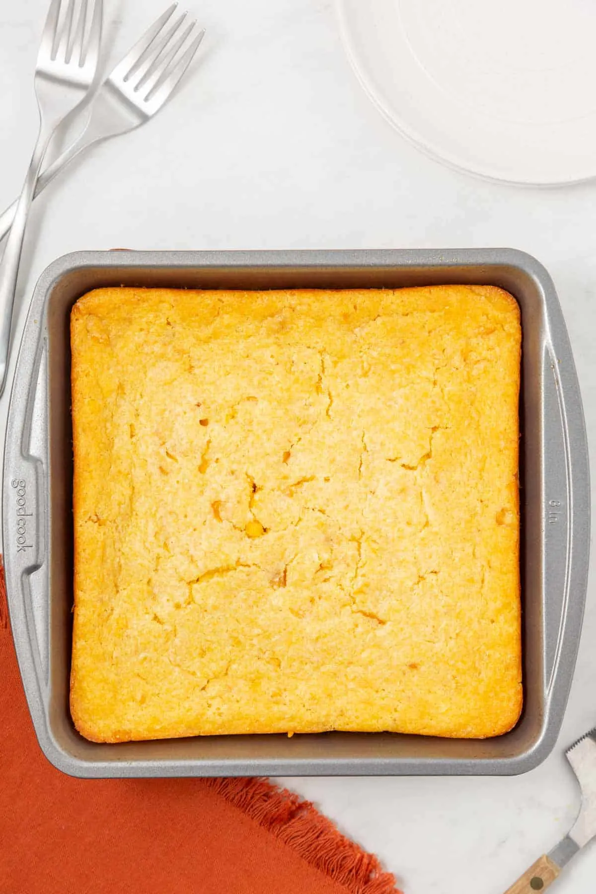 Corn Soufflé is a moist and delicious corn casserole recipe made with canned whole kernel corn, cream corn, sour cream, egg, Jiffy corn muffin mix and melted butter.