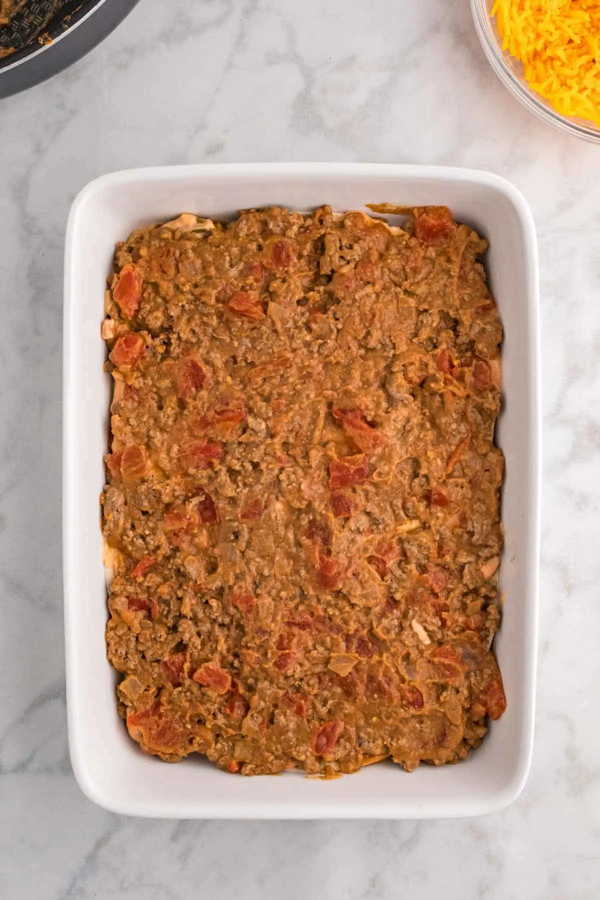 beef and bean burrito mixture in a casserole dish