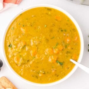 Crock Pot Split Pea Soup is a hearty slow cooker soup recipe made with split peas, carrots, celery, onions, vegetable broth and seasonings.