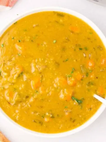 Crock Pot Split Pea Soup is a hearty slow cooker soup recipe made with split peas, carrots, celery, onions, vegetable broth and seasonings.