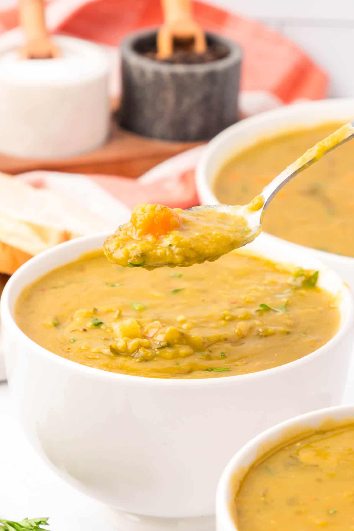 Crock Pot Split Pea Soup is a hearty slow cooker soup recipe made with split peas, carrots, celery, onions, vegetable broth and seasonings.