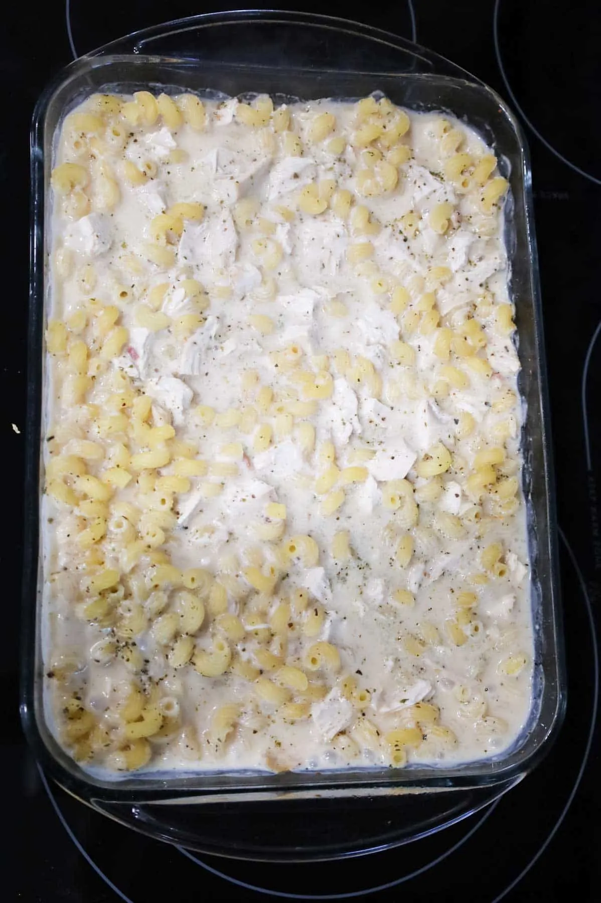 cooked chicken alfredo mixture in a baking dish