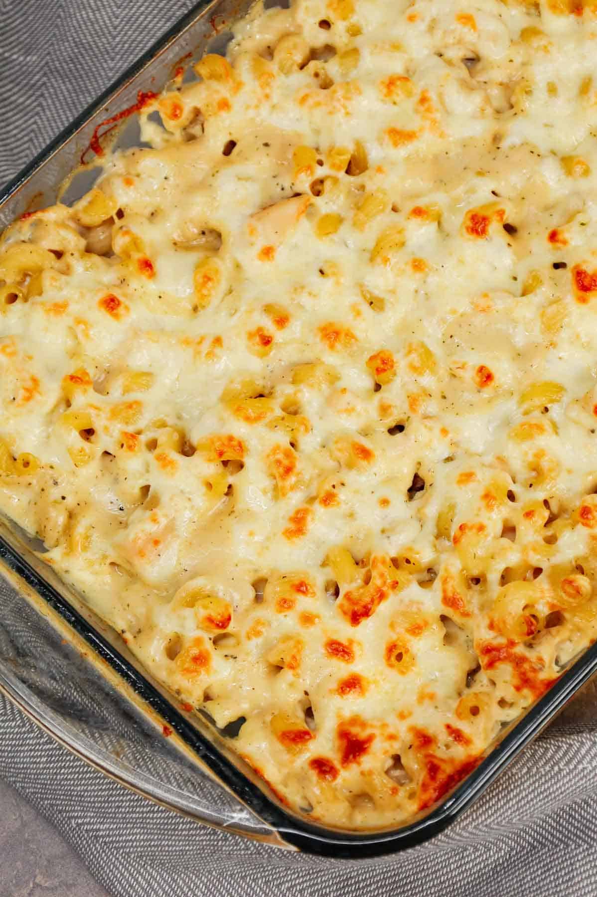 Dump and Bake Chicken Alfredo is an easy one dish meal made with cavatappi pasta, jarred alfredo sauce, condensed cream of bacon soup, chicken broth, chopped rotisserie chicken and mozzarella cheese.