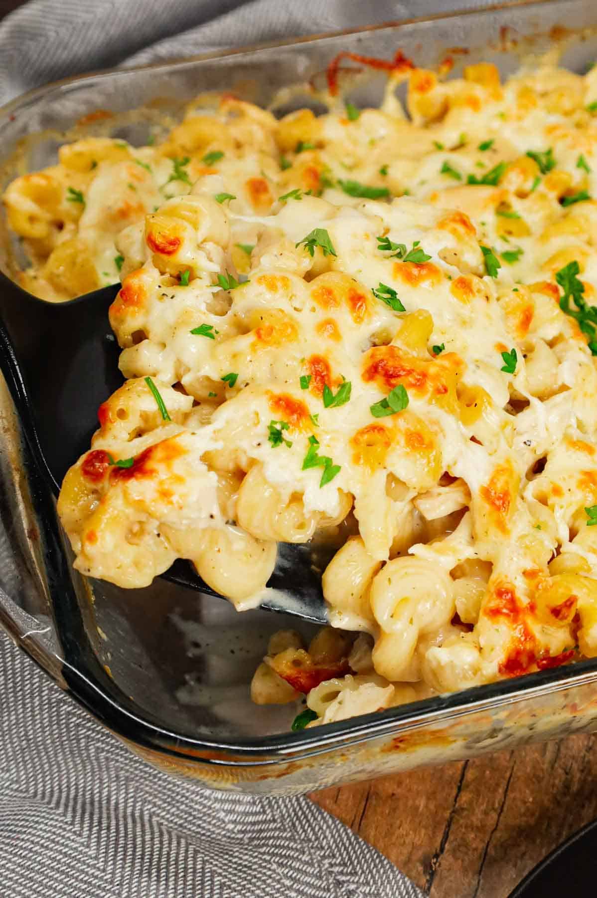 Dump and Bake Chicken Alfredo is an easy one dish meal made with cavatappi pasta, jarred alfredo sauce, condensed cream of bacon soup, chicken broth, chopped rotisserie chicken and mozzarella cheese.