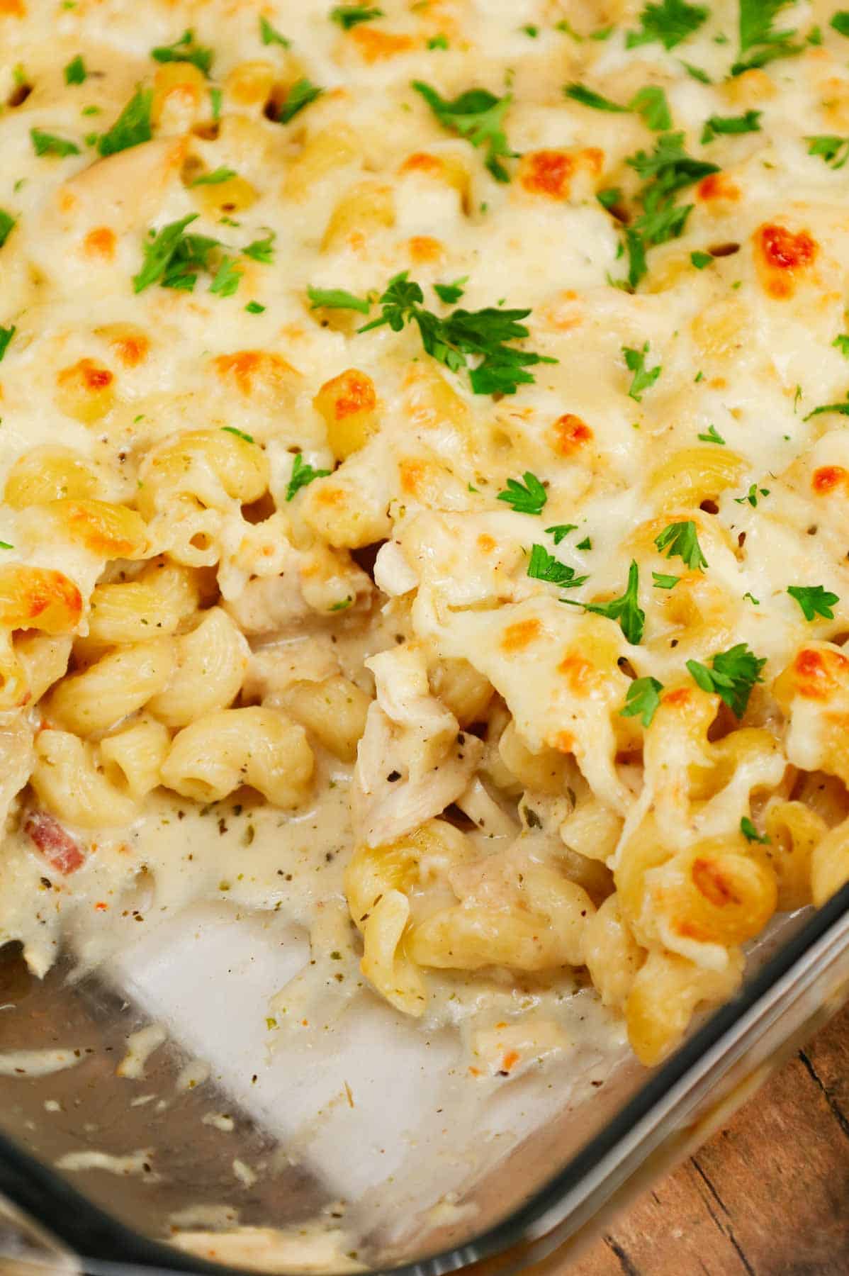 Dump and Bake Chicken Alfredo is an easy one dish meal made with cavatappi pasta, jarred alfredo sauce, condensed cream of bacon soup, chicken broth, chopped rotisserie chicken and mozzarella cheese.