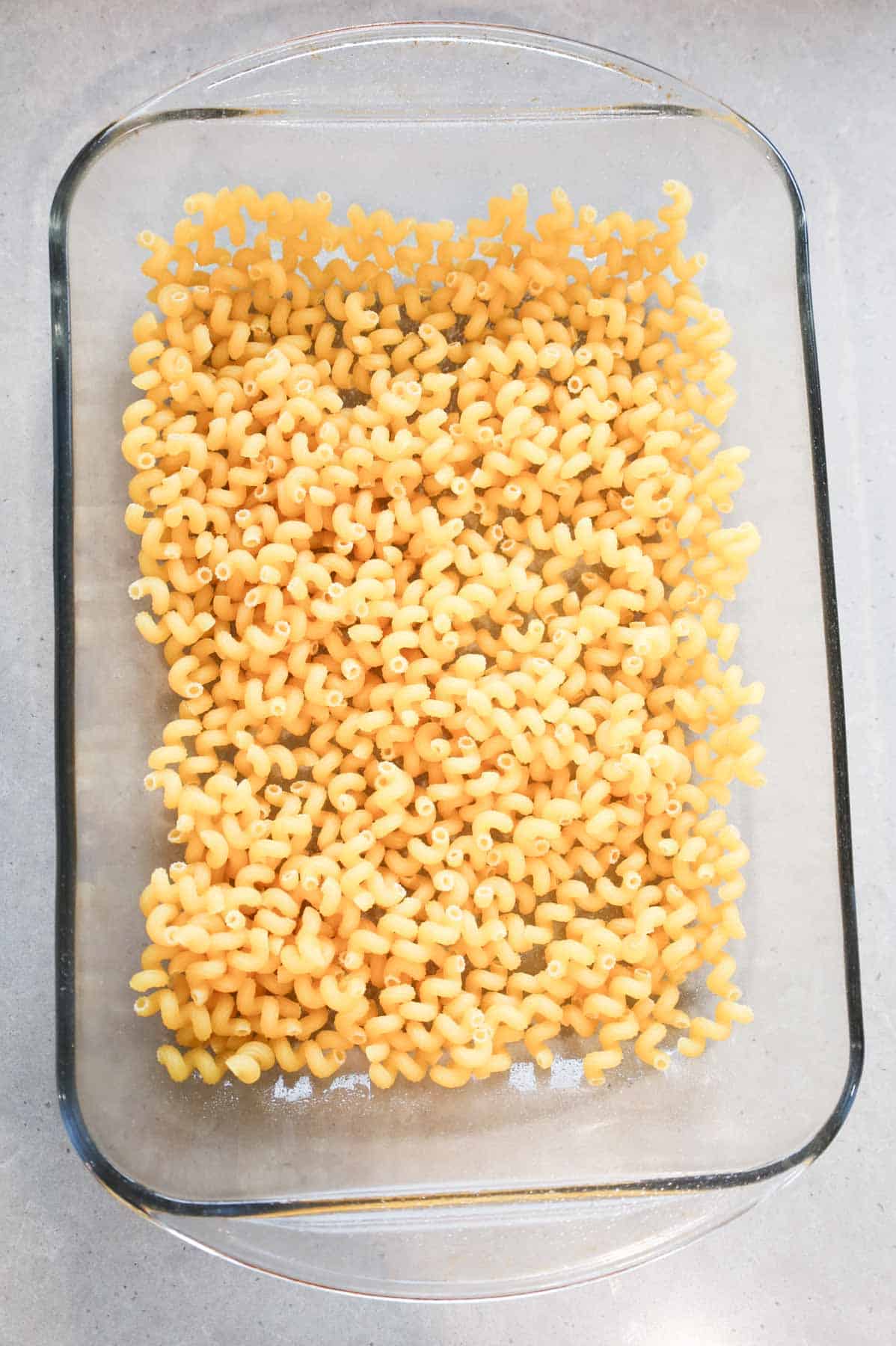 uncooked pasta noodles in a baking dish