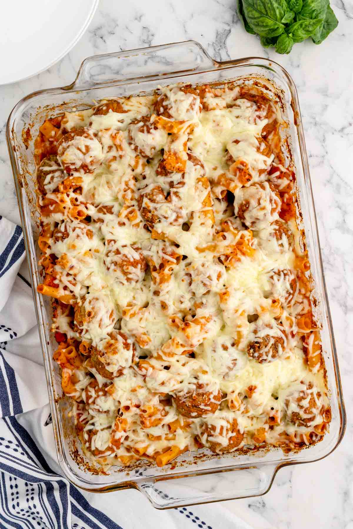 Dump and Bake Meatball Pasta Casserole is an easy dinner recipe with ziti noodles, chicken stock, pasta sauce, Italian seasoning and turkey meatballs all cooked together in one dish and then topped with mozzarella cheese.