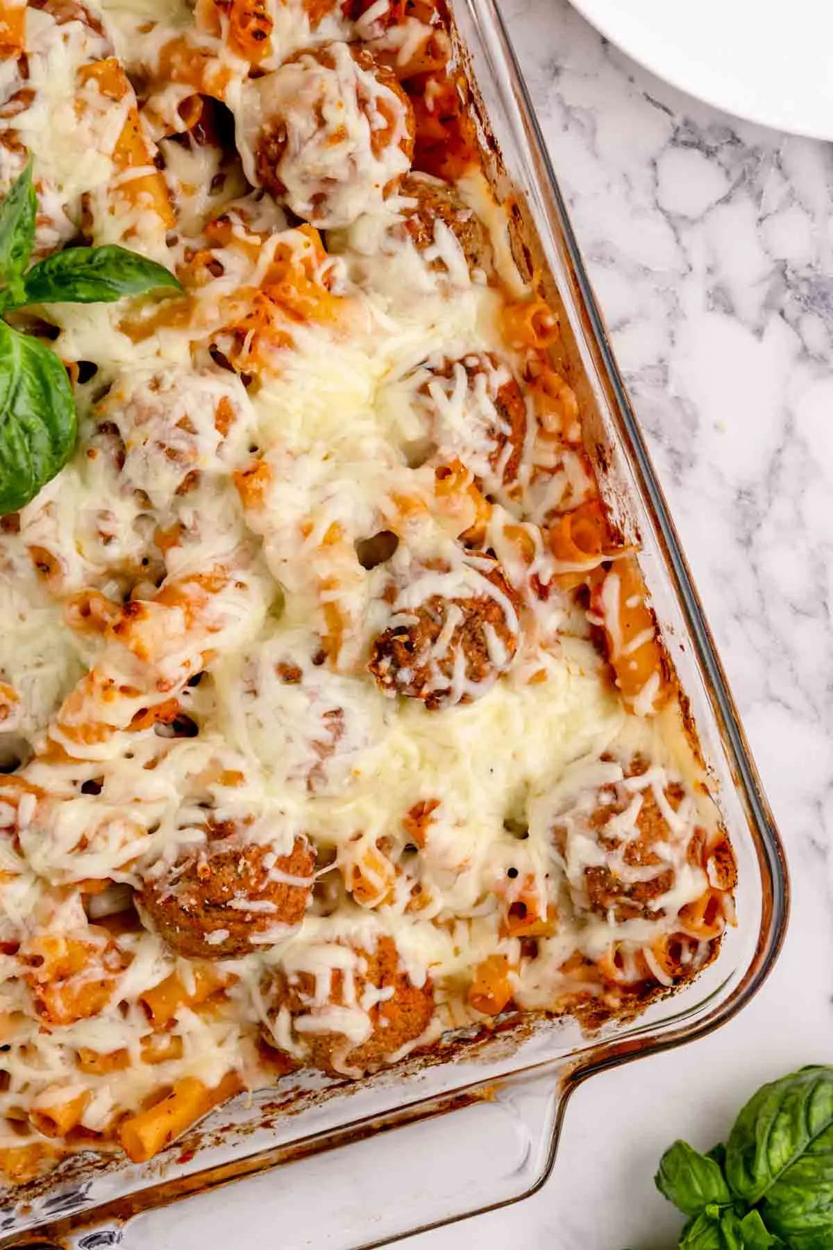 Dump and Bake Meatball Pasta Casserole is an easy dinner recipe with ziti noodles, chicken stock, pasta sauce, Italian seasoning and turkey meatballs all cooked together in one dish and then topped with mozzarella cheese.