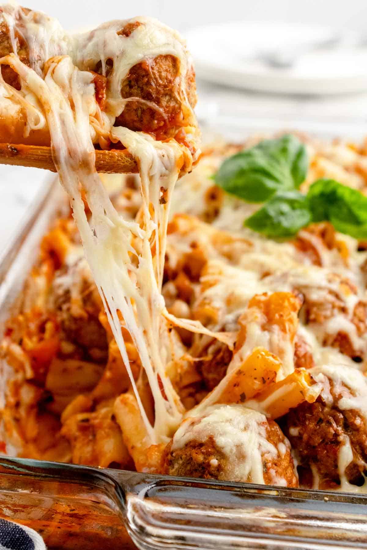 Dump and Bake Meatball Pasta Casserole is an easy dinner recipe with ziti noodles, chicken stock, pasta sauce, Italian seasoning and turkey meatballs all cooked together in one dish and then topped with mozzarella cheese.