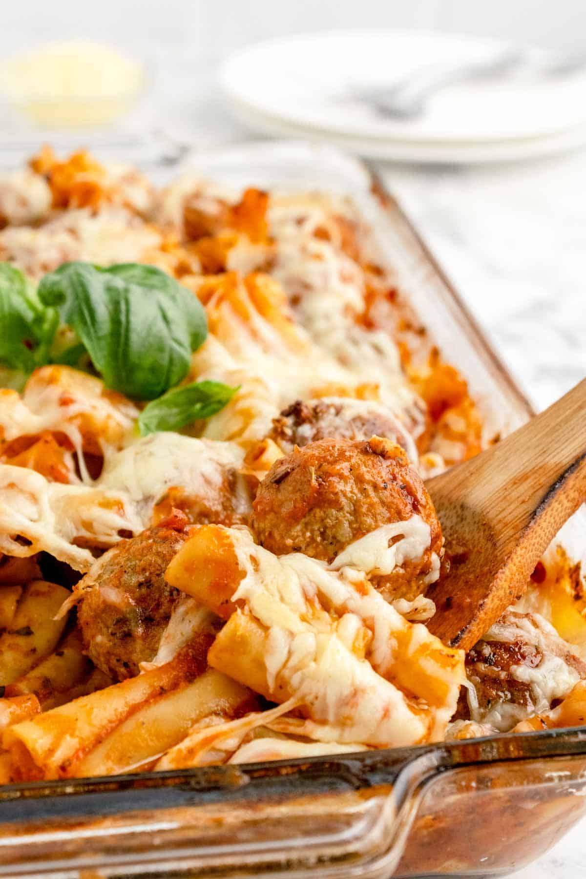 Dump and Bake Meatball Pasta Casserole is an easy dinner recipe with ziti noodles, chicken stock, pasta sauce, Italian seasoning and turkey meatballs all cooked together in one dish and then topped with mozzarella cheese.