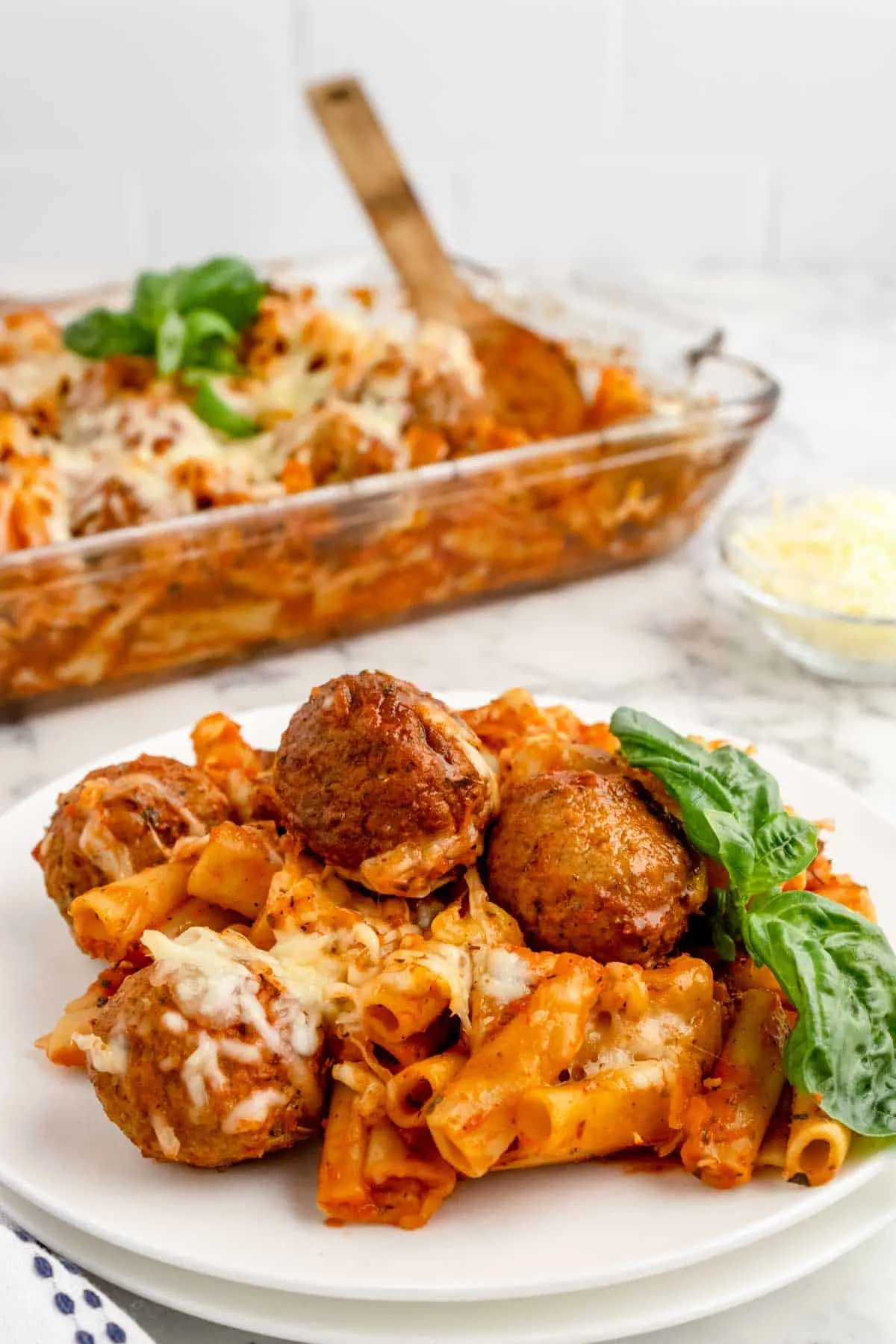 Dump and Bake Meatball Pasta Casserole is an easy dinner recipe with ziti noodles, chicken stock, pasta sauce, Italian seasoning and turkey meatballs all cooked together in one dish and then topped with mozzarella cheese.