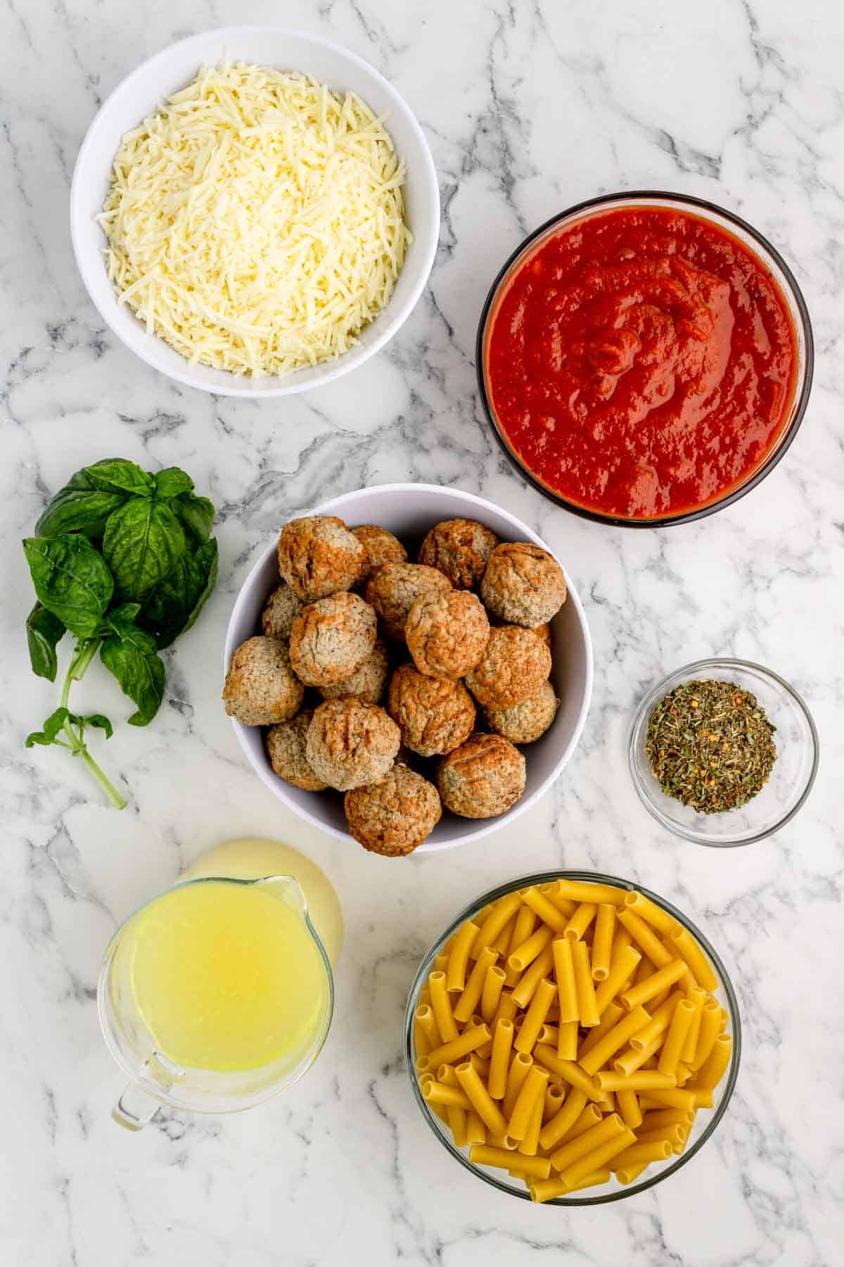 dump and bake meatball pasta casserole ingredients in prep bowls