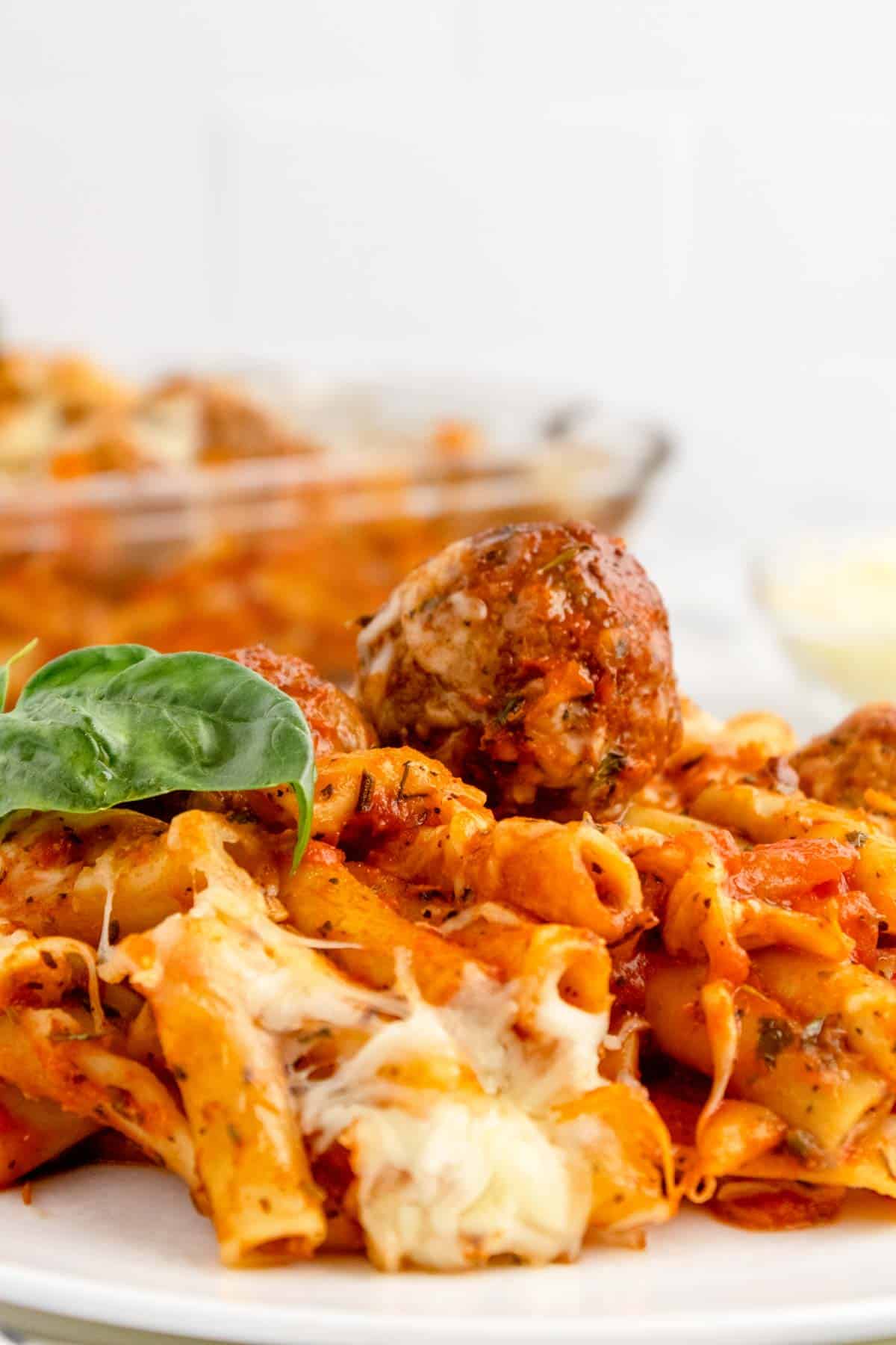 Dump and Bake Meatball Pasta Casserole is an easy dinner recipe with ziti noodles, chicken stock, pasta sauce, Italian seasoning and turkey meatballs all cooked together in one dish and then topped with mozzarella cheese.