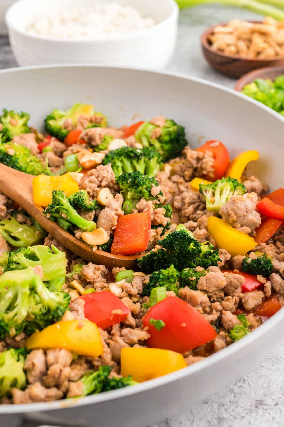 Ground Turkey Stir Fry is an easy weeknight dinner recipe loaded with bell peppers, broccoli, green onions and cashews all cooked in a sweet and savoury stir fry sauce seasoned with fresh garlic and ginger.