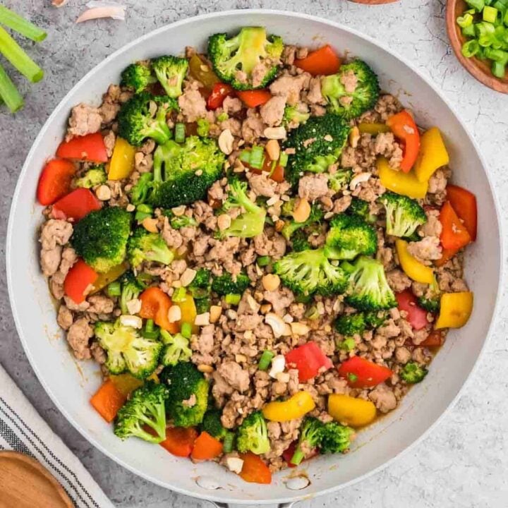 Ground Turkey Stir Fry is an easy weeknight dinner recipe loaded with bell peppers, broccoli, green onions and cashews all cooked in a sweet and savoury stir fry sauce seasoned with fresh garlic and ginger.