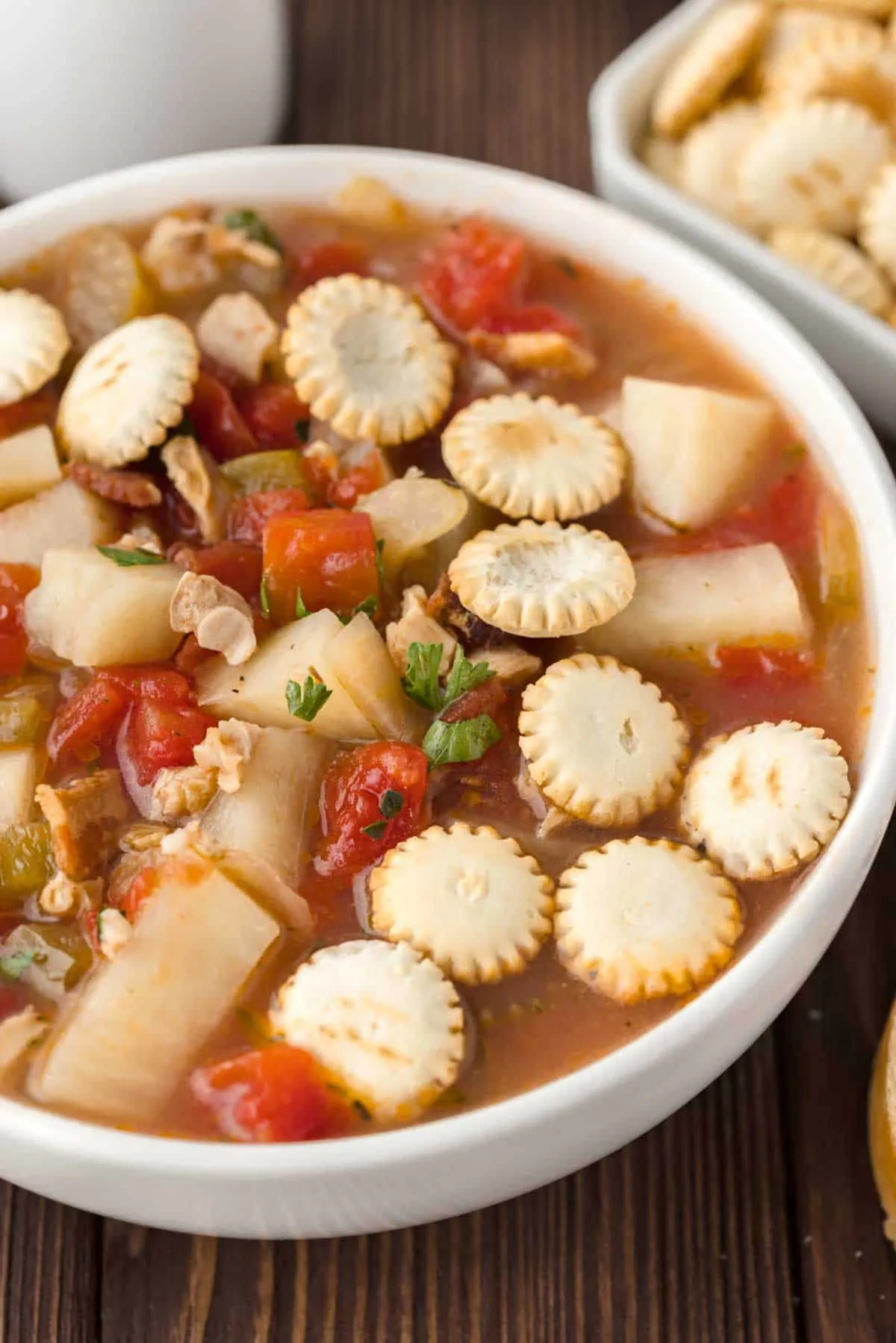 Manhattan Clam Chowder is a hearty soup loaded with chopped clams, diced tomatoes, potatoes, celery and chopped bacon all in a flavourful tomato broth.