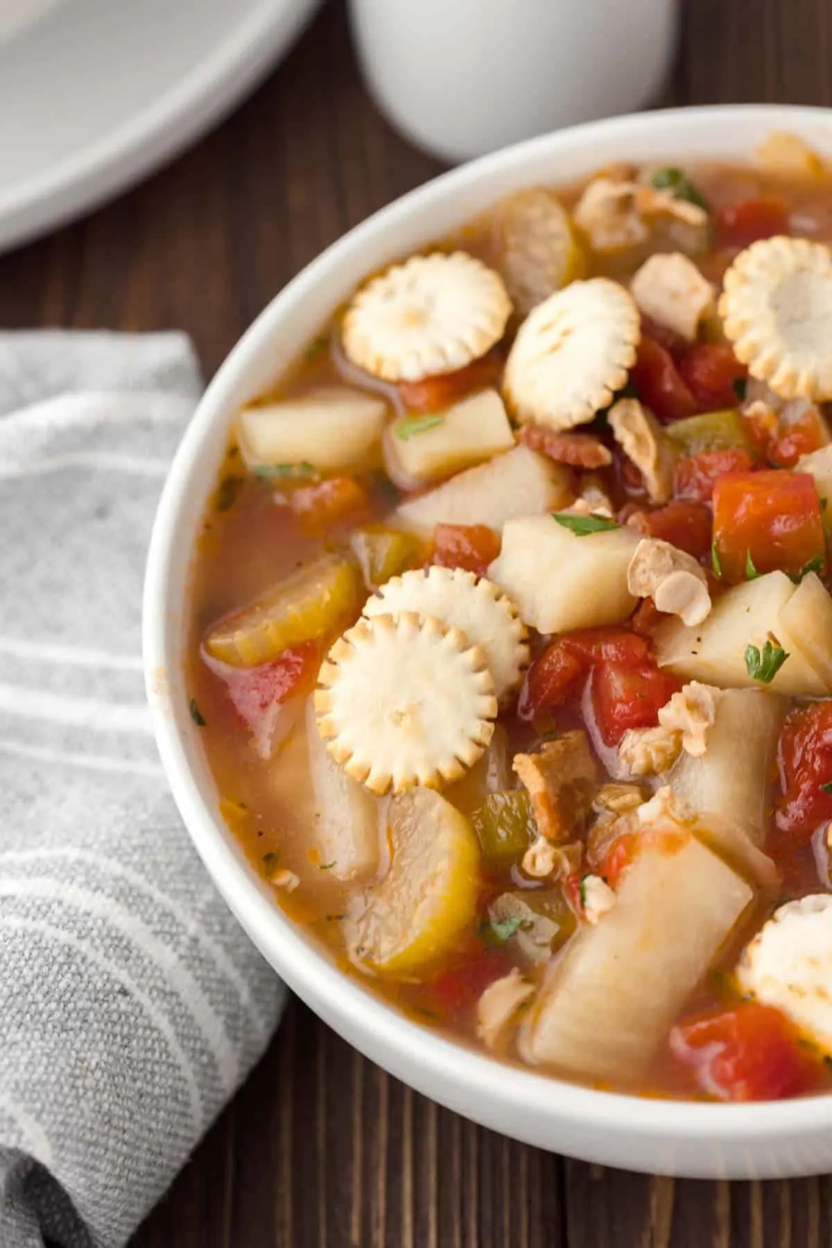 Manhattan Clam Chowder is a hearty soup loaded with chopped clams, diced tomatoes, potatoes, celery and chopped bacon all in a flavourful tomato broth.