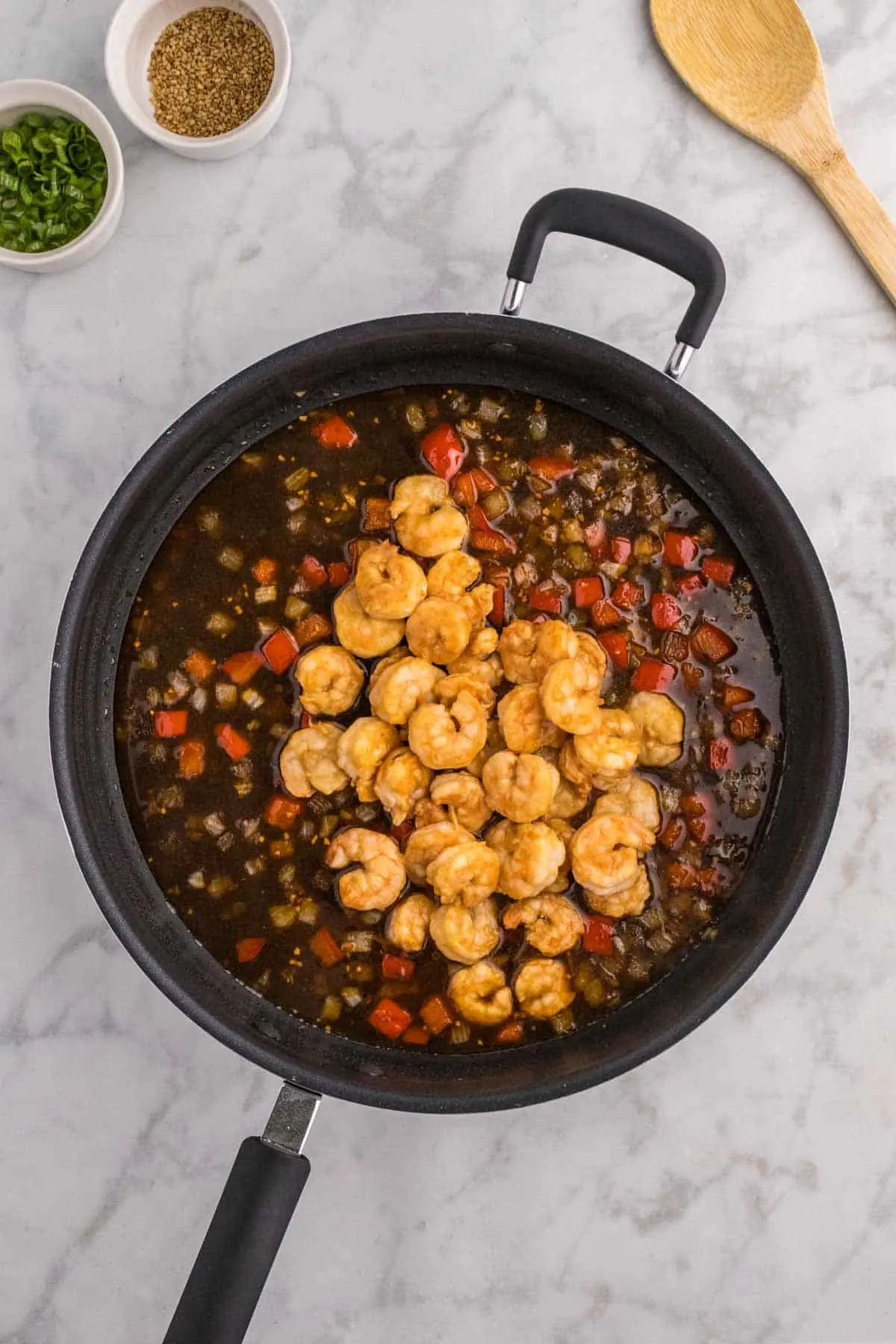 cooked shrimp added to skillet with Mongolian sauce
