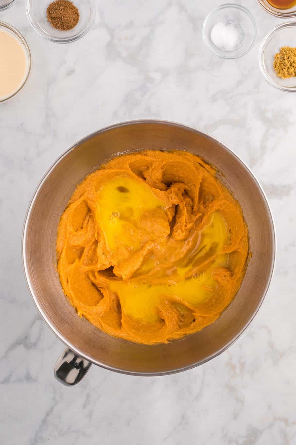 beaten eggs added to whipped sweet potato mixture in a bowl