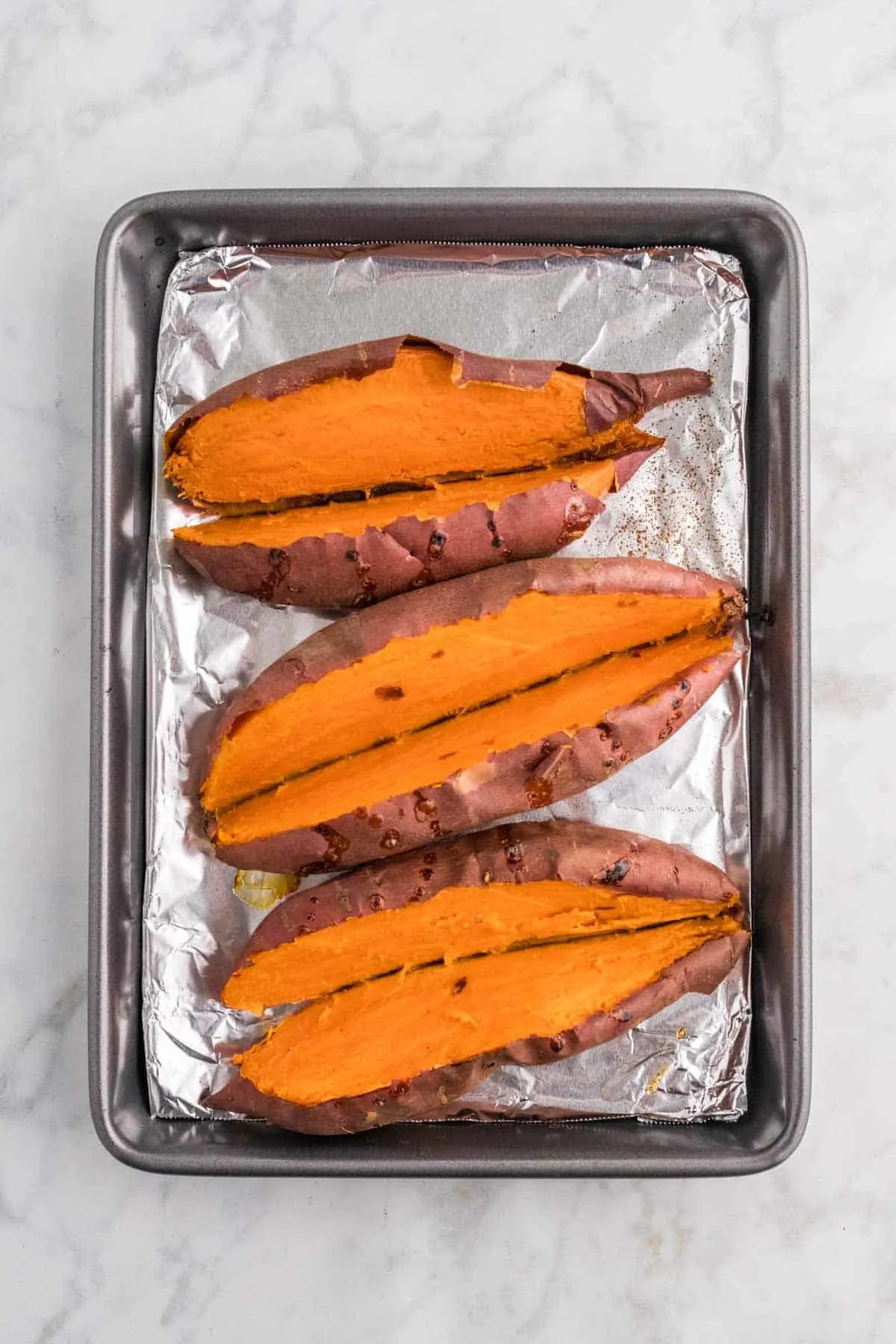 baked sweet potatoes sliced in half