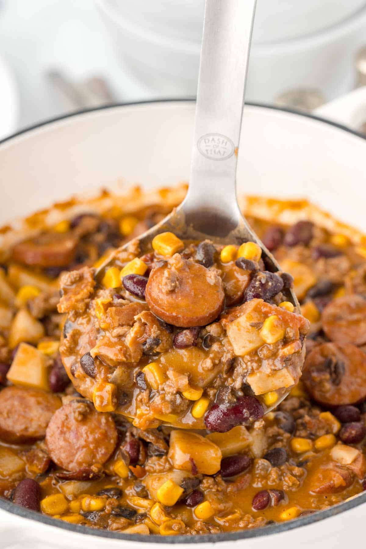 Texas Cowboy Stew is a hearty dish loaded with ground beef, smoked sausage, bacon, potatoes, corn, beans and diced tomatoes all in a flavourful beef broth.