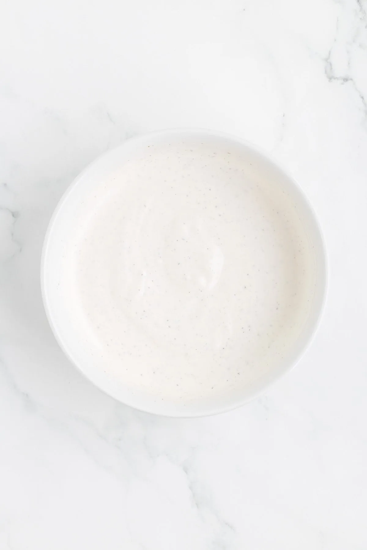 mayo and sour cream dressing in a mixing bowl